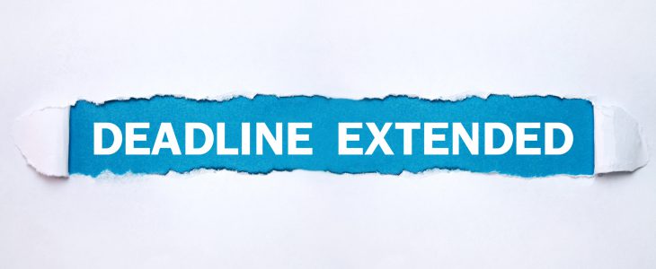 Deadline Extended text on torn paper.